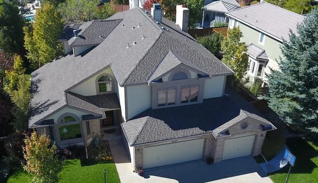 Aerial drone image of a two-story home and its roofline